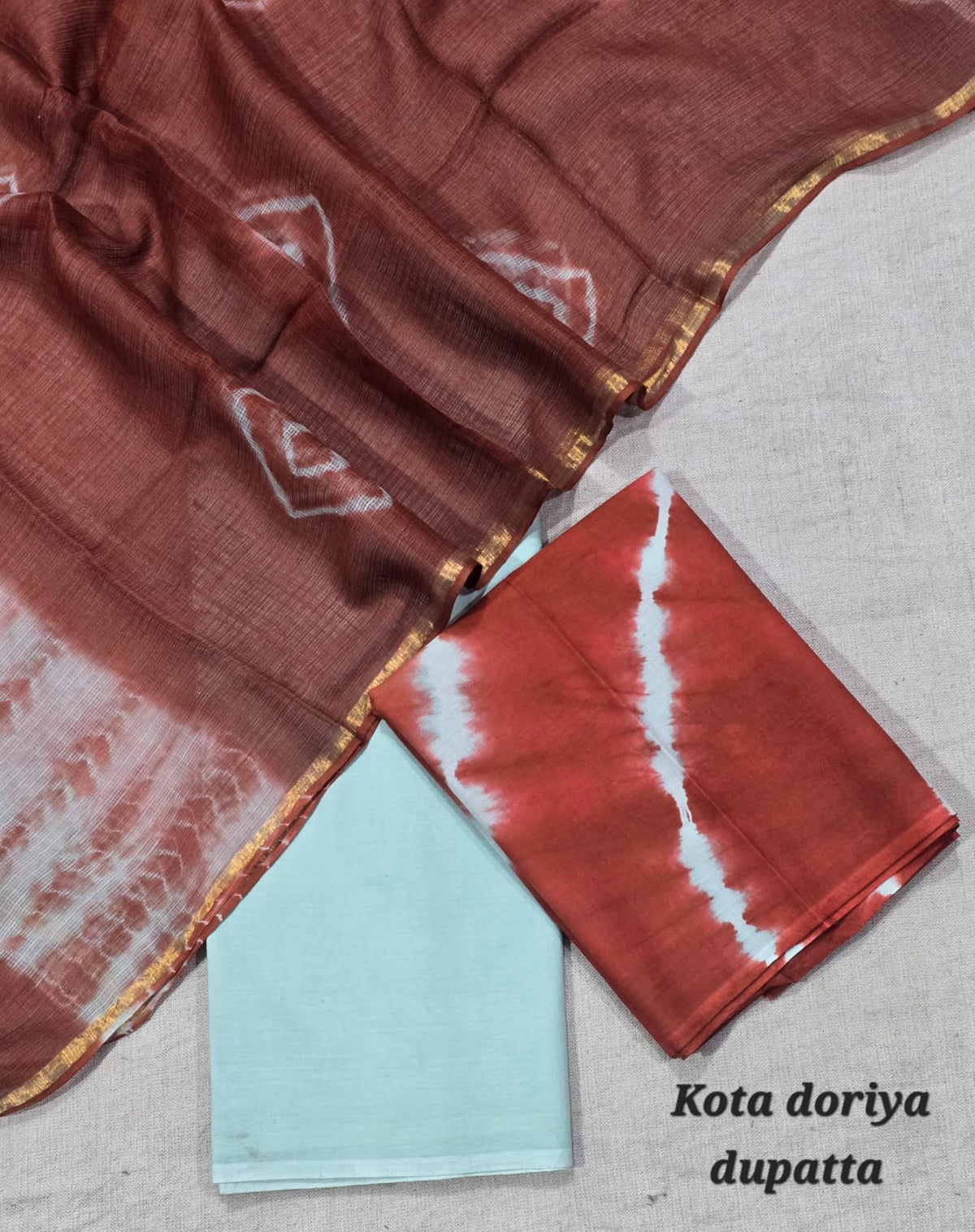 Rust Tie-Dye Cotton Suit with Sky Blue Bottom & Kota Doriya Dupatta